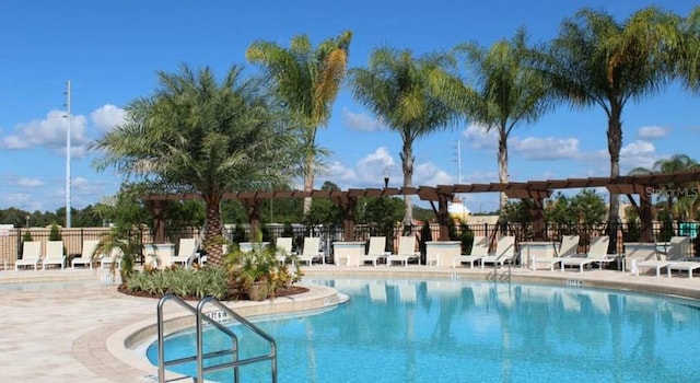 view of swimming pool with a patio