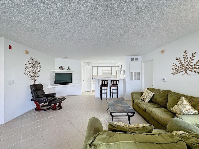 living room with a textured ceiling