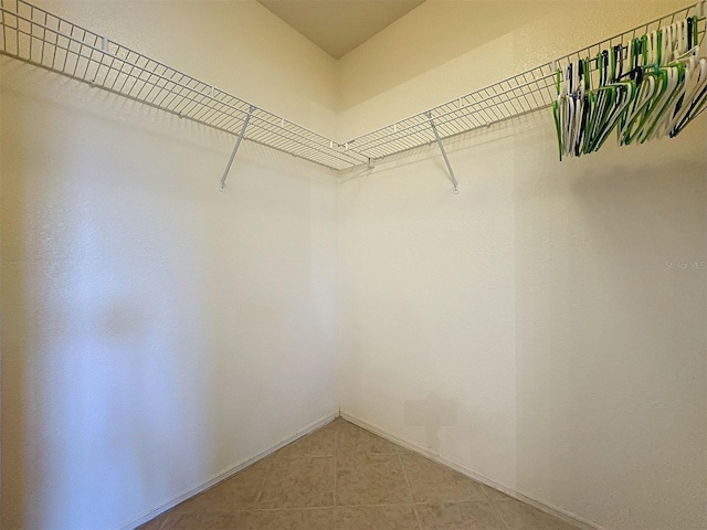 spacious closet with tile patterned flooring