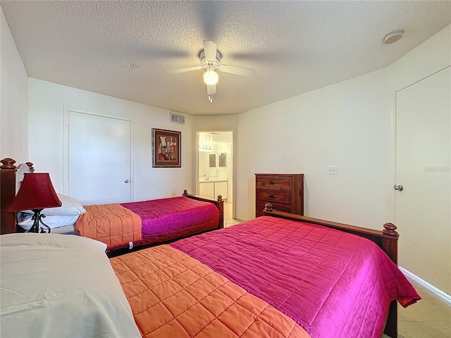 bedroom featuring ceiling fan and a textured ceiling