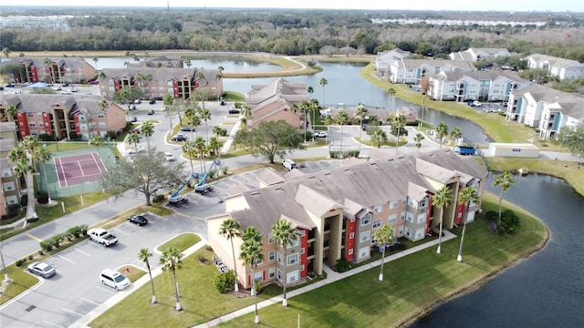 birds eye view of property featuring a water view