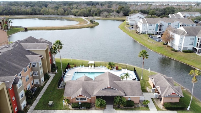 birds eye view of property with a water view