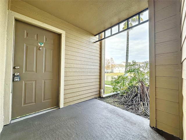 doorway to property with covered porch