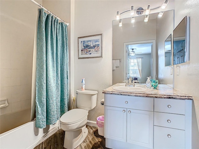 full bathroom featuring shower / bath combo, vanity, ceiling fan, hardwood / wood-style flooring, and toilet