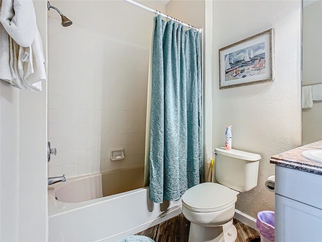 full bathroom featuring shower / tub combo, vanity, toilet, and hardwood / wood-style floors