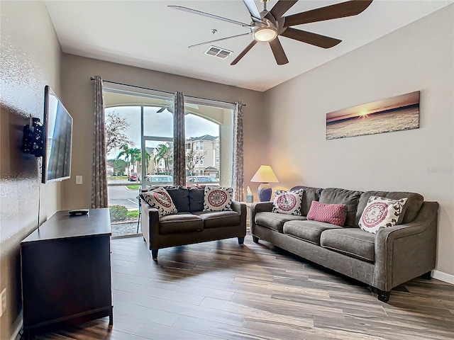 living room with ceiling fan and hardwood / wood-style floors