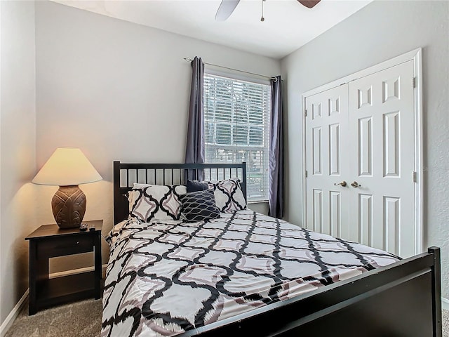 carpeted bedroom with a closet and ceiling fan