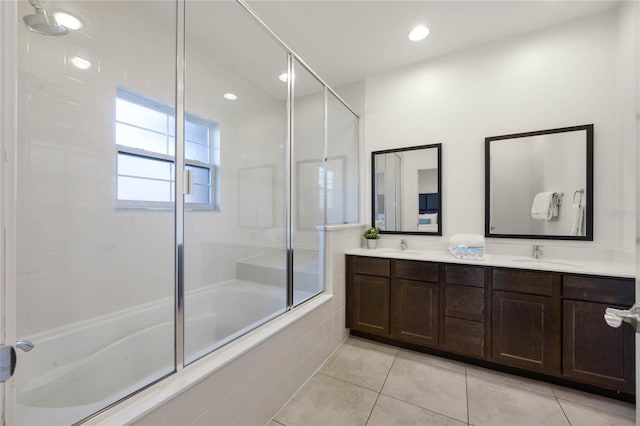 bathroom featuring tile patterned flooring, vanity, and bath / shower combo with glass door