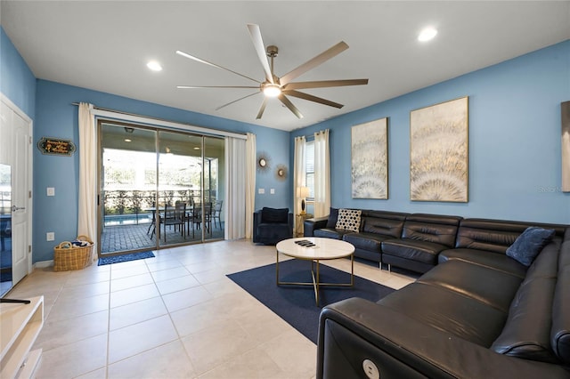 tiled living room featuring a wealth of natural light and ceiling fan