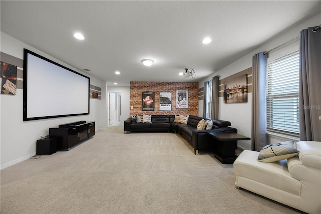 cinema with light colored carpet and a wealth of natural light