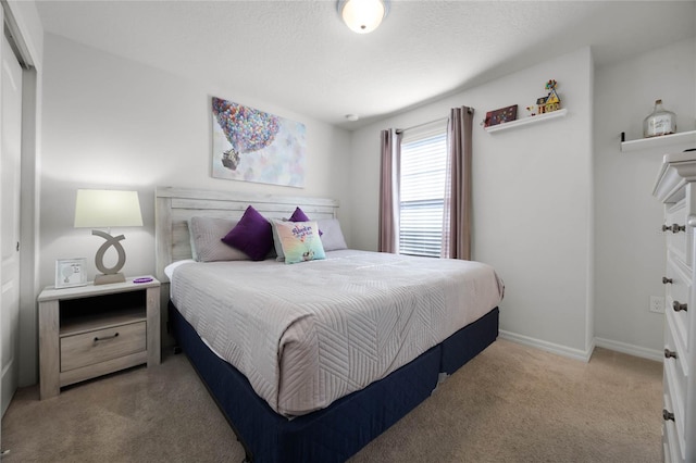 bedroom with light colored carpet