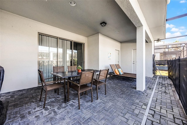 view of patio / terrace with glass enclosure