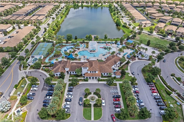 birds eye view of property with a water view