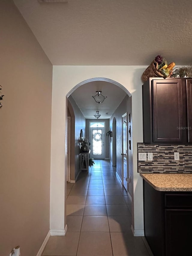 corridor with light tile patterned floors