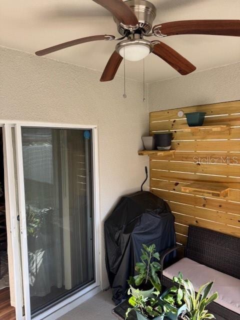 view of patio with a grill and ceiling fan