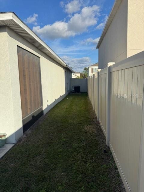 view of property exterior with central AC unit