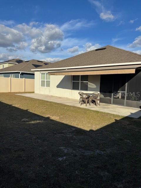 rear view of house with a patio