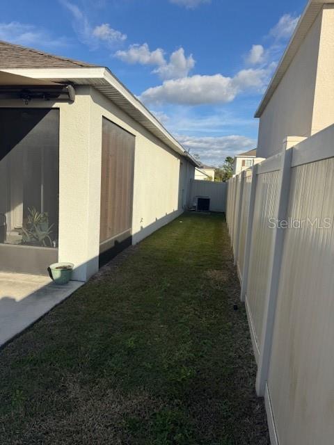 view of home's exterior featuring a yard