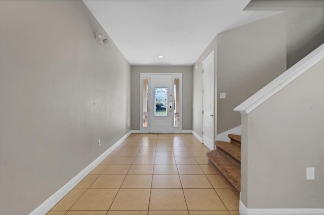 foyer entrance with light tile patterned floors