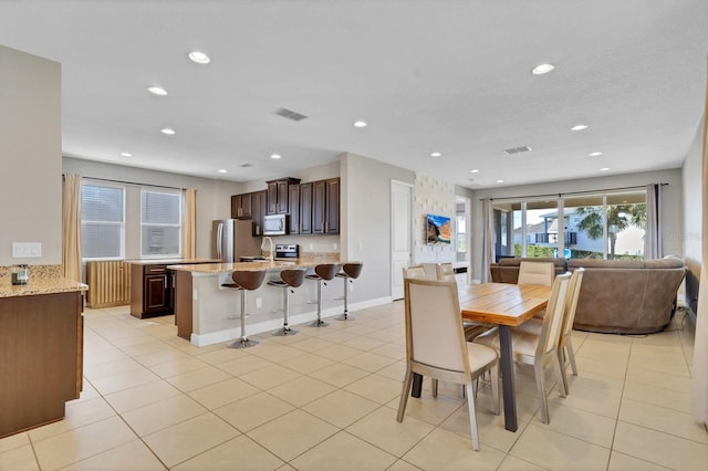 tiled dining space with sink