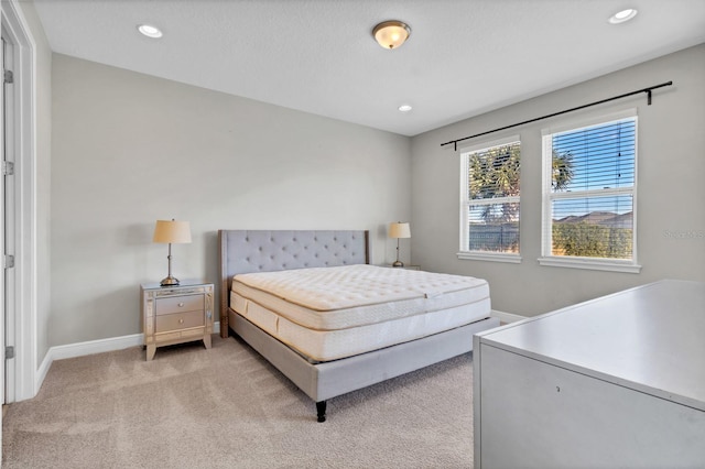 bedroom featuring light carpet