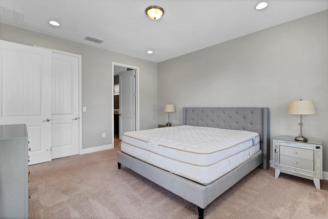 bedroom featuring light colored carpet