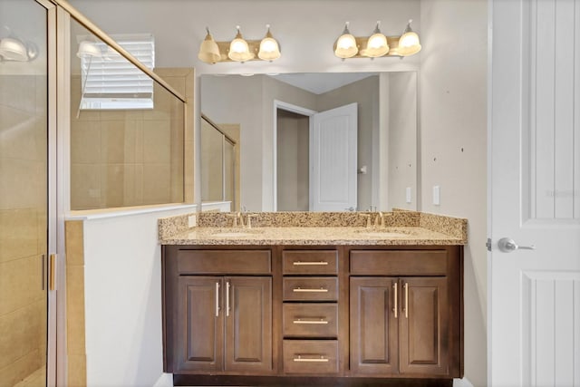 bathroom with an enclosed shower and vanity