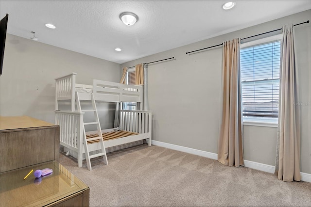 unfurnished bedroom featuring light colored carpet