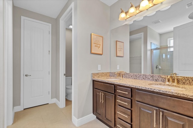 bathroom with vanity, an enclosed shower, tile patterned floors, and toilet