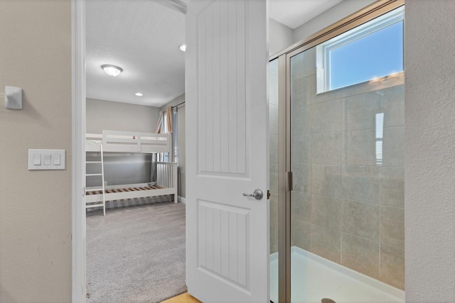 bathroom featuring an enclosed shower