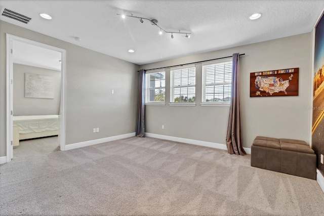 interior space featuring a textured ceiling