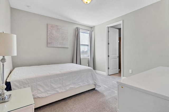 bedroom with light carpet