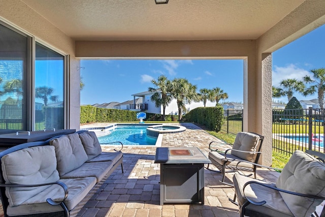 view of swimming pool with a patio, an in ground hot tub, and an outdoor living space