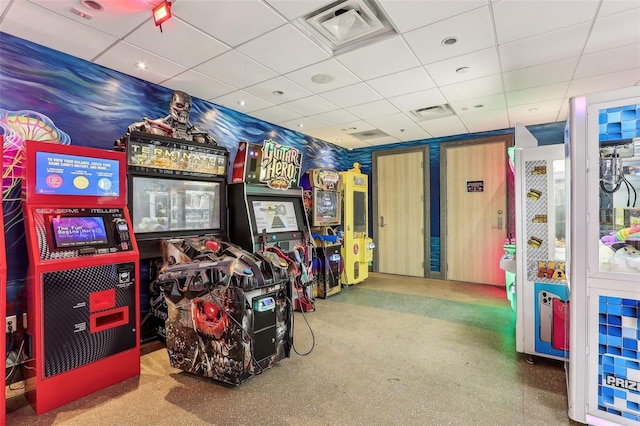 game room with a paneled ceiling