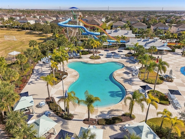 view of swimming pool featuring a patio and a water slide