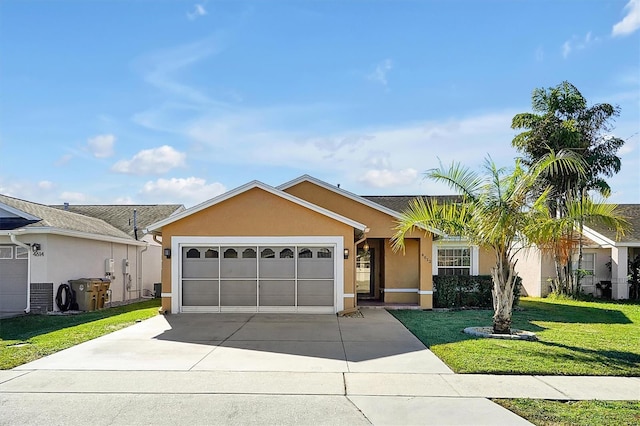 ranch-style home featuring a garage and a front lawn