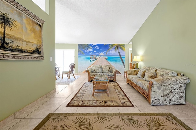 living room with vaulted ceiling and light tile patterned floors