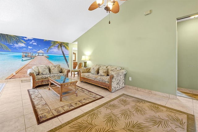 living room with high vaulted ceiling, light tile patterned floors, and ceiling fan