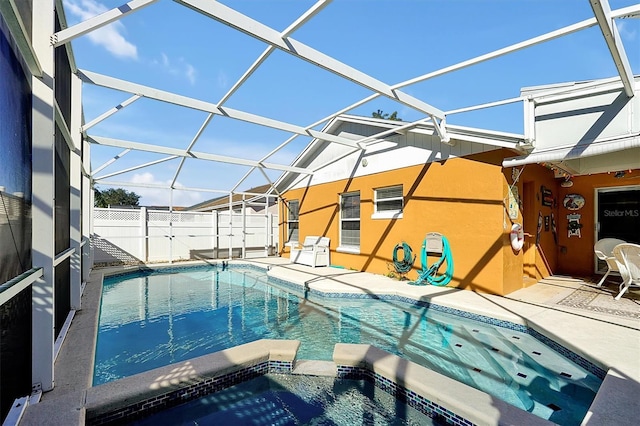 view of swimming pool with a patio and a lanai