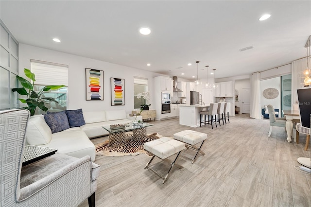 living room with light hardwood / wood-style flooring