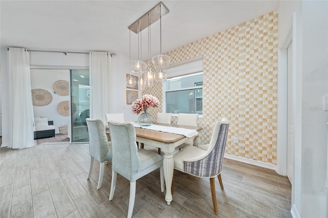 dining area featuring light wood-type flooring