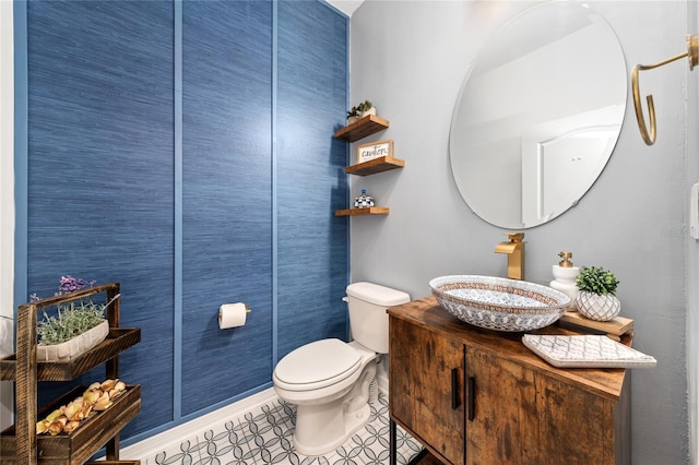 bathroom with tile patterned floors, vanity, and toilet