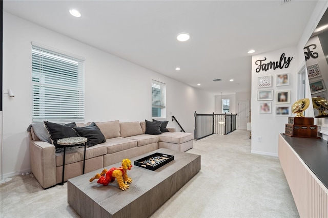 living room featuring light carpet