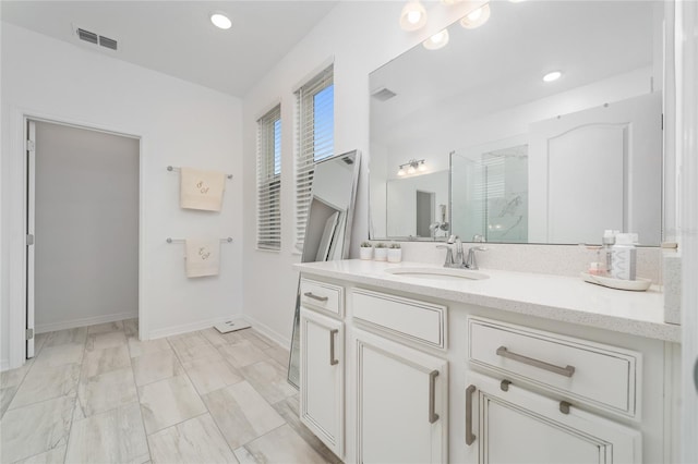 bathroom with vanity and walk in shower