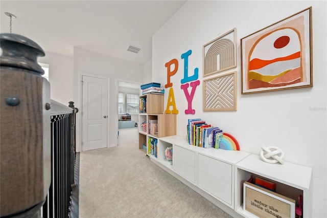 interior space featuring light colored carpet