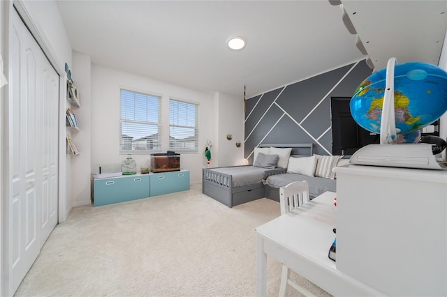 carpeted bedroom with a closet