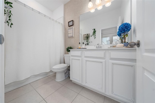 full bathroom featuring tile patterned flooring, vanity, toilet, and shower / tub combo