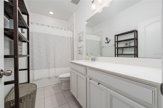 full bathroom featuring tile patterned floors, vanity, toilet, and shower / tub combo with curtain