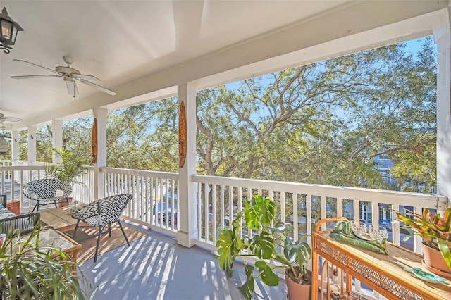 balcony featuring ceiling fan