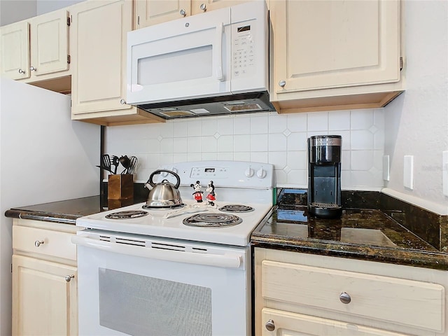 kitchen featuring decorative backsplash, white cabinets, and white appliances